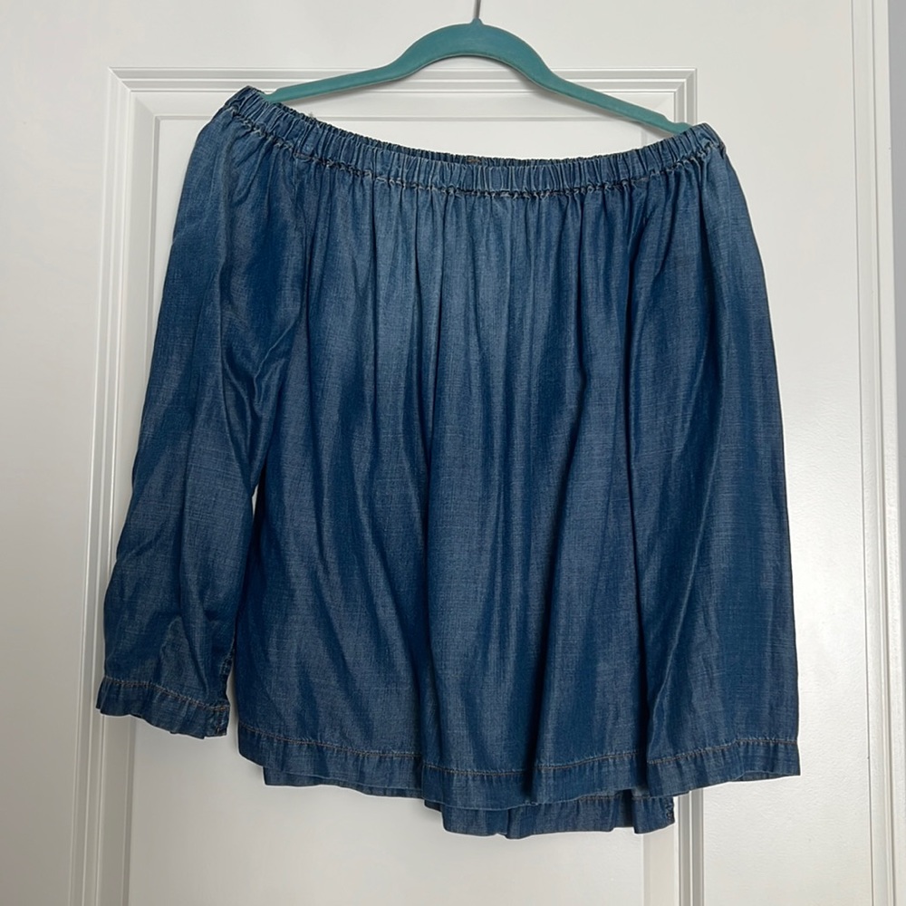 Women's off-the-shoulder denim shirt from Anthropologie.